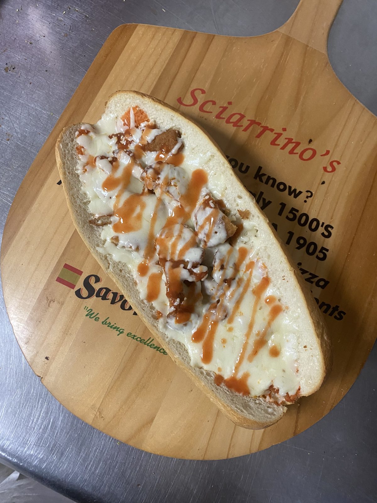 Buffalo Soldier sub with crispy chicken, melted cheese, buffalo and ranch drizzle