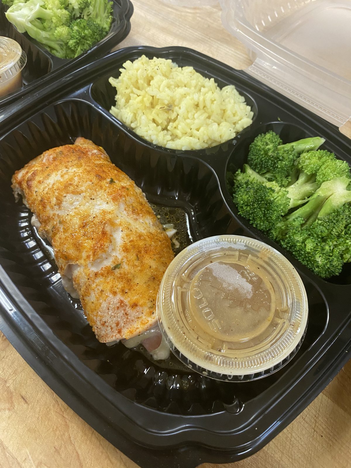 Chicken cordon bleu dinner with rice and broccoli